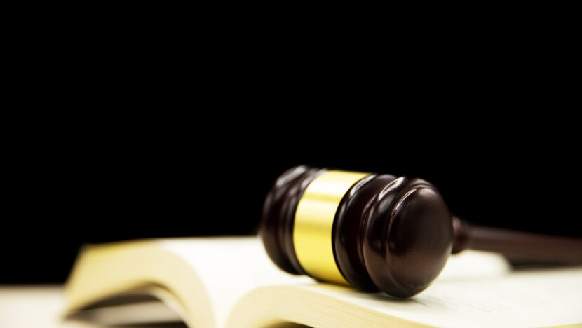 Judges gavel on book and wooden table. Law and justice concept b