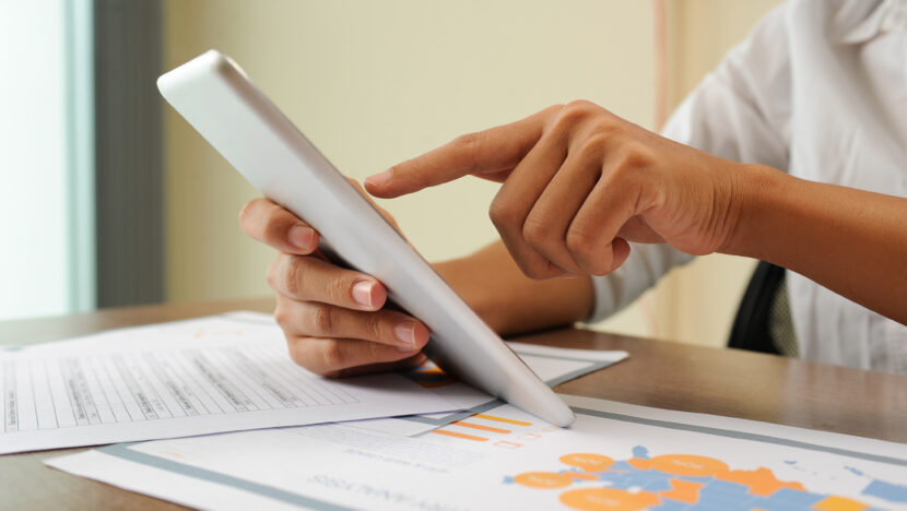 closeup person holding using tablet