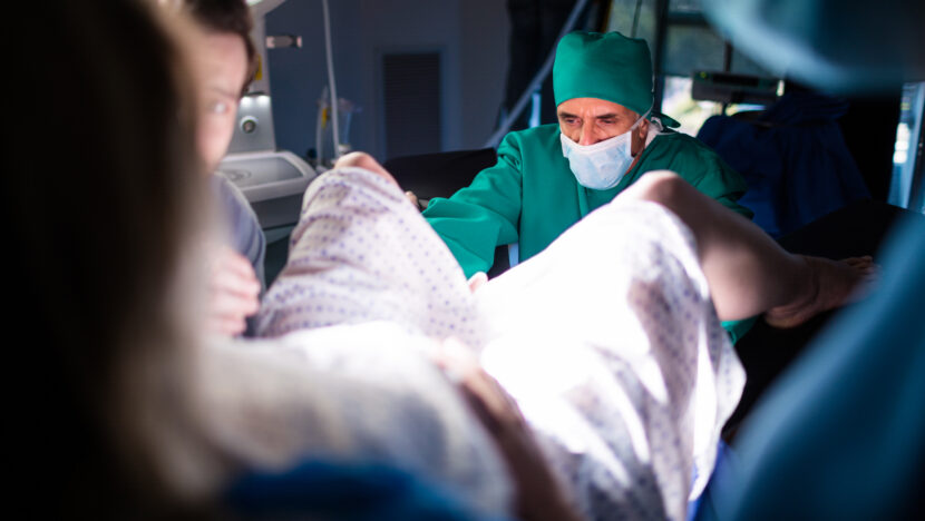 doctor examining pregnant woman delivery