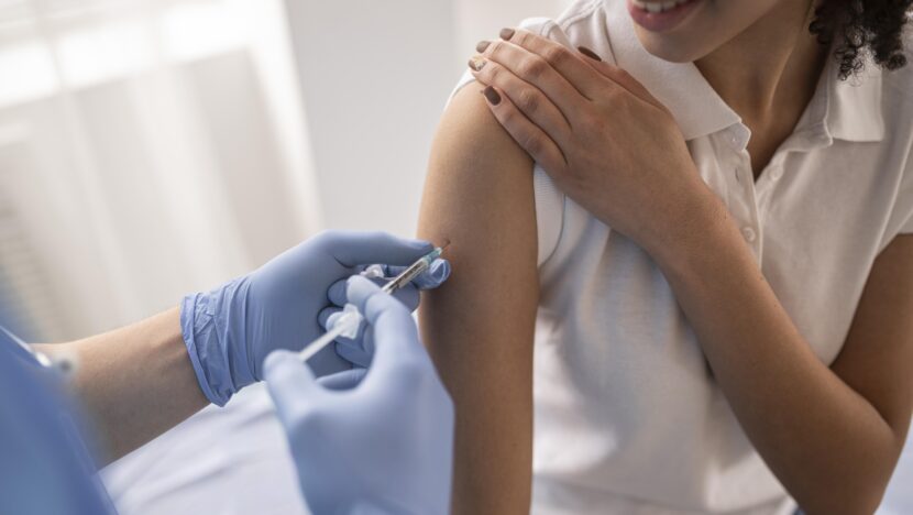doctor vaccinating patient clinic