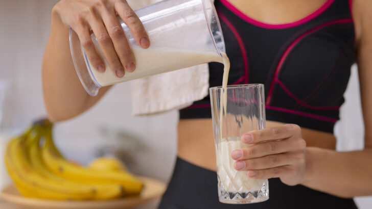 front view woman pouring milk