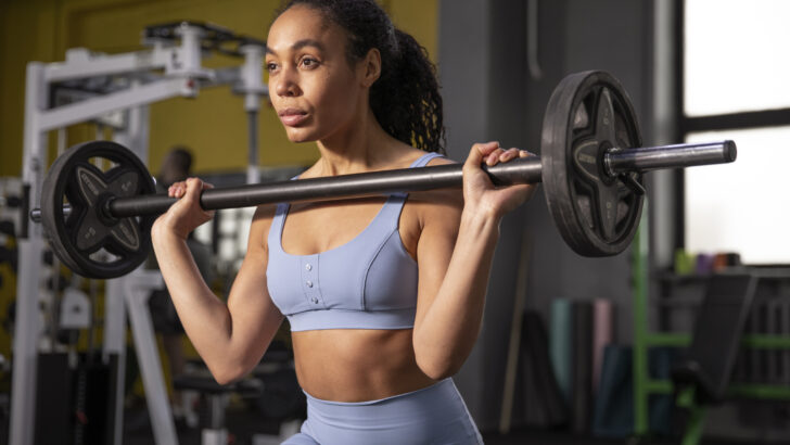 woman training weightlifting gym