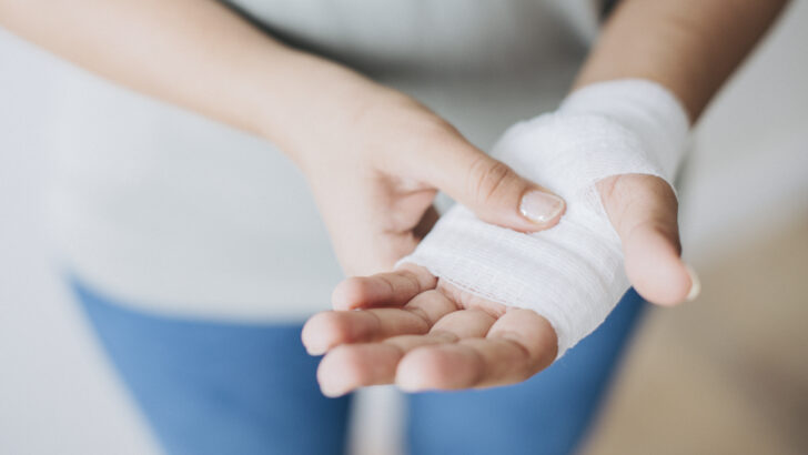 woman with gauze bandage wrapped around her hand