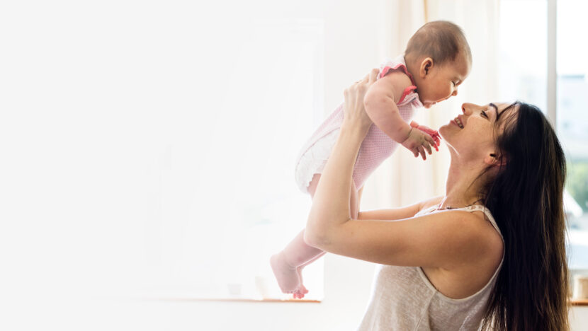 young mom holding her baby air blank space