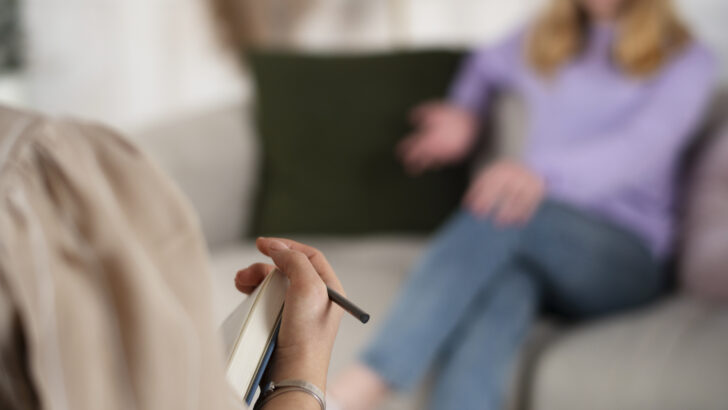 sided view young girl talking therapist