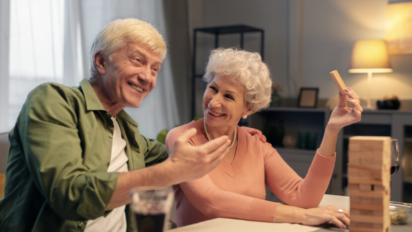 senior friends having party night Copia