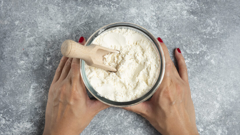 woman hand holding glass bowl flour marble Copia