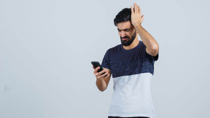 young handsome man using phone