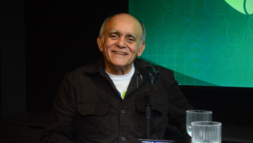 Médico Francisco Rodrigues sorrindo, com camisa branca e casaco escuro